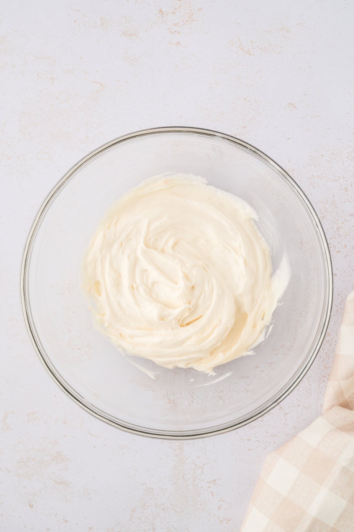 Cream cheese glaze in mixing bowl.