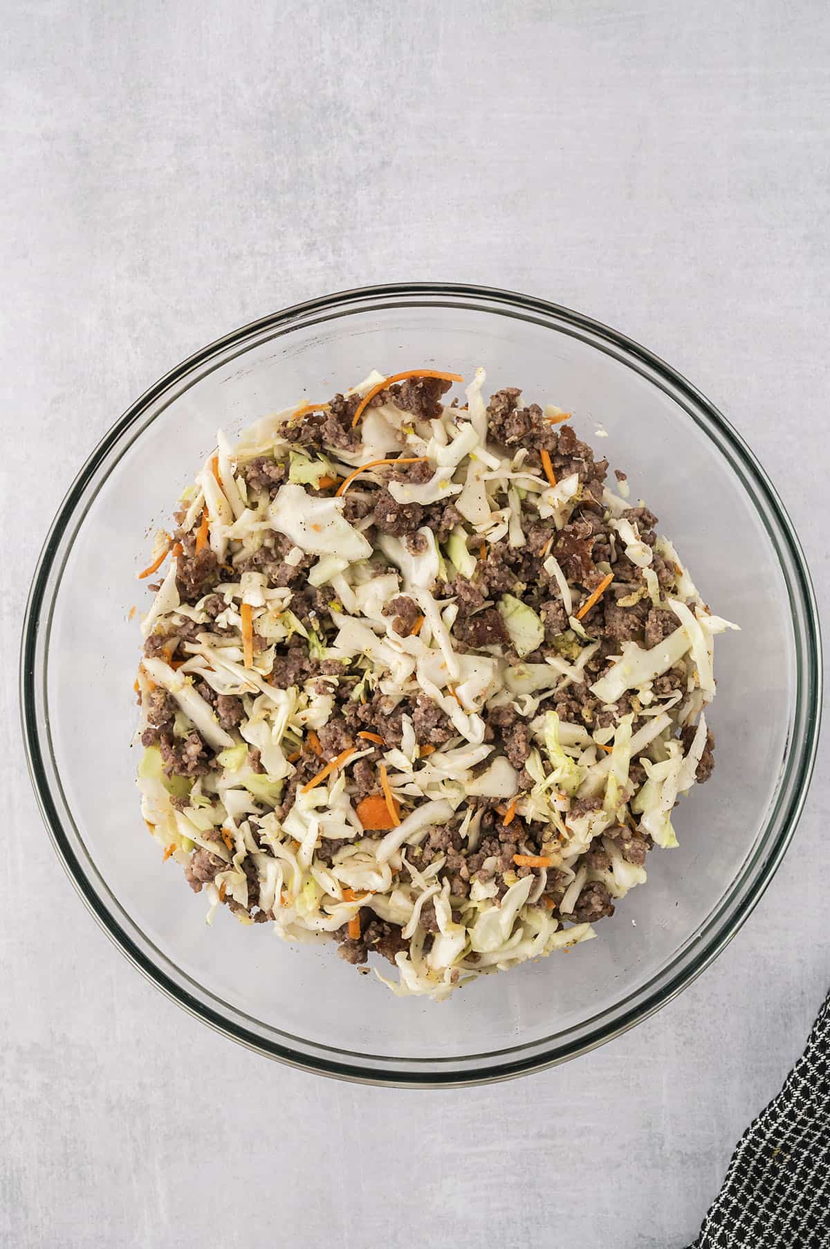 Egg roll filling ingredients in mixing bowl.