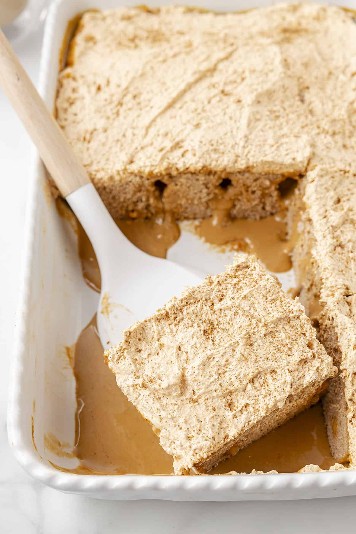 Pumpkin poke cake in pan.