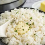 Jasmine rice in black bowl.