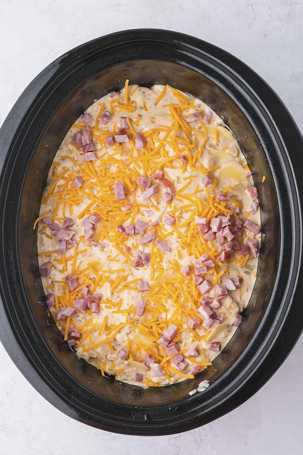 Scalloped potatoes with ham in the slow cooker.