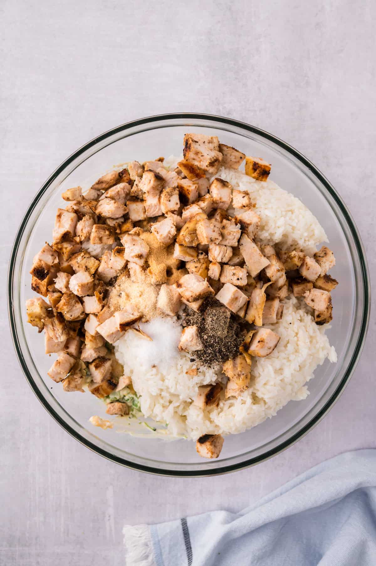 Rice and chicken in bowl of broccoli.