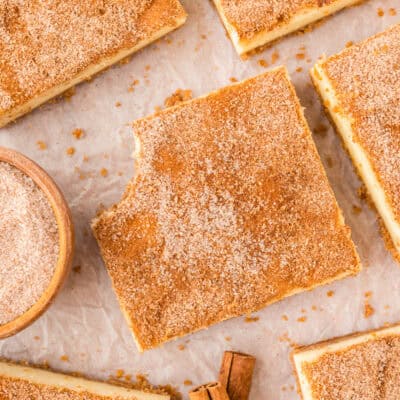 Snickerdoodle cheesecake bars on counter.