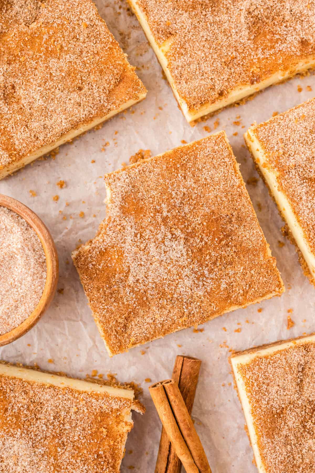 Snickerdoodle cheesecake bars on counter.