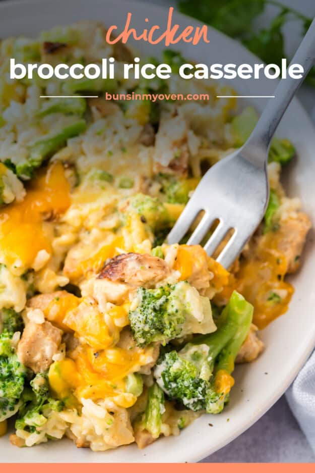 Forful of cheesy broccoli rice casserole recipe with chicken on plate.