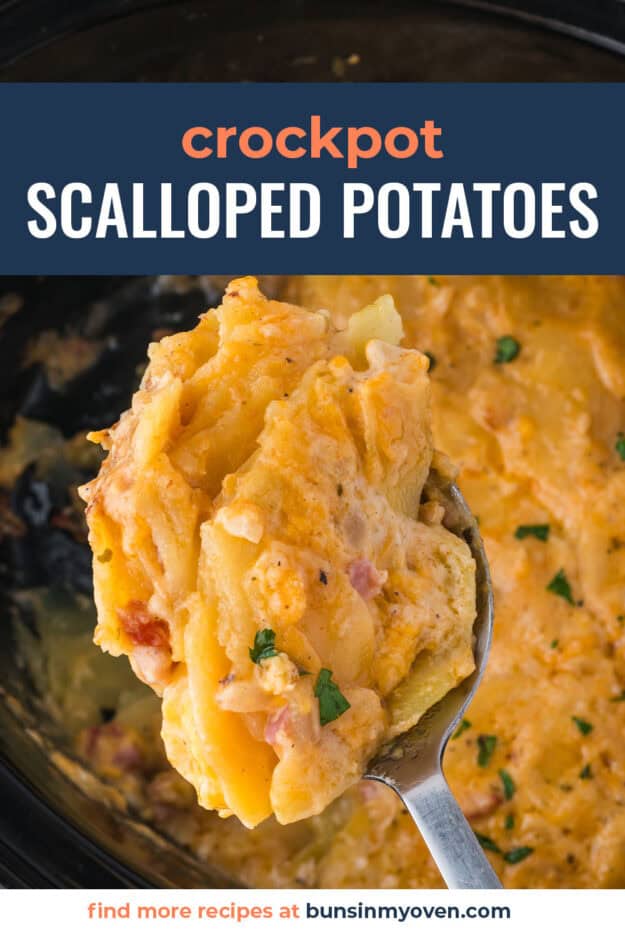 Scalloped potatoes on spoon over crockpot.