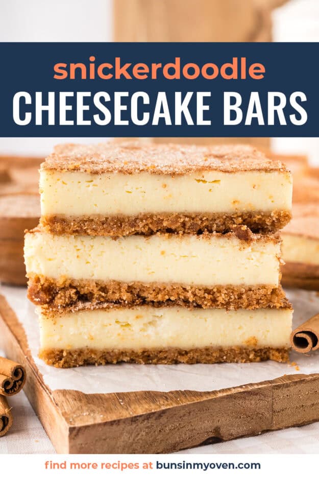 Snickerdoodle cheesecake bars stacked on cutting board.