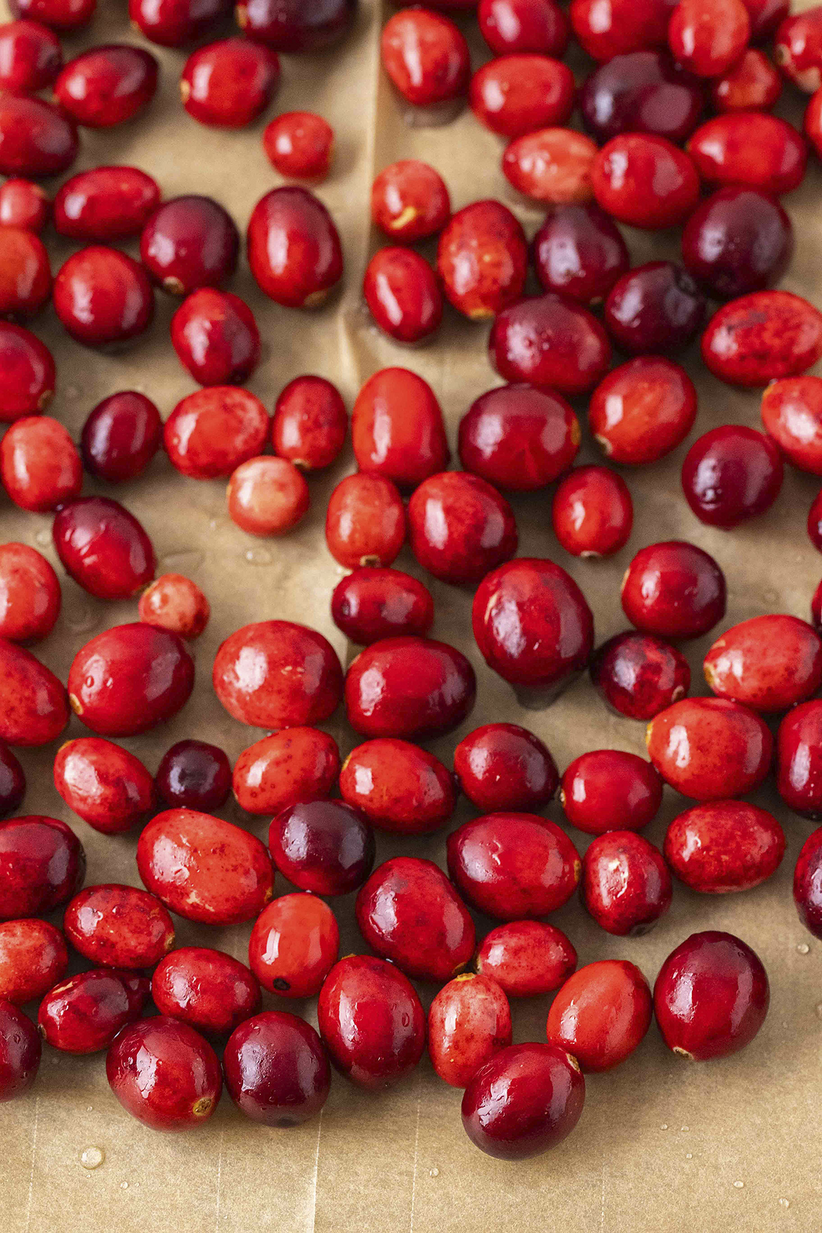 Cranberries on parchment paper.