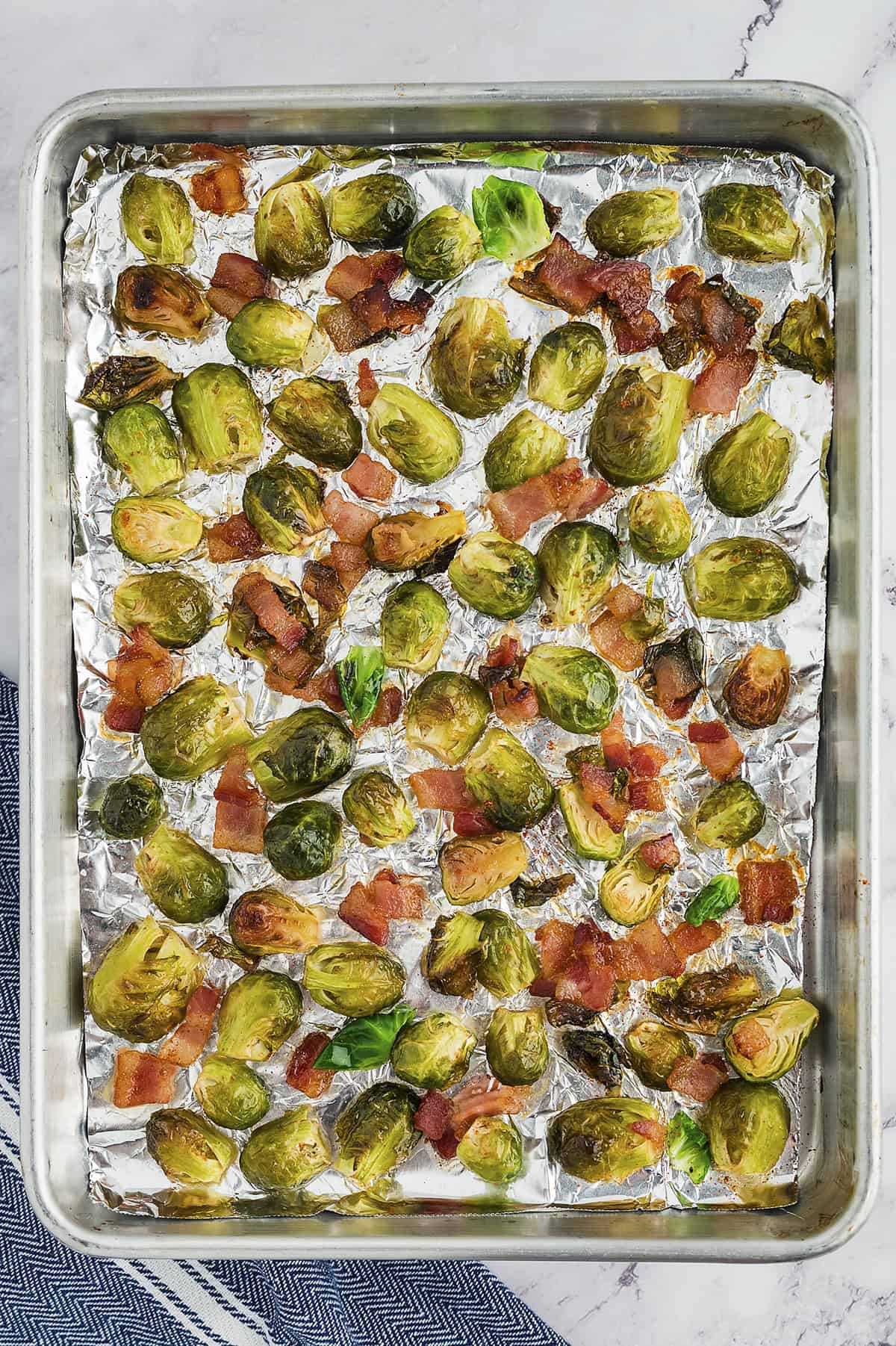 Roasted brussels sprouts on sheet pan.