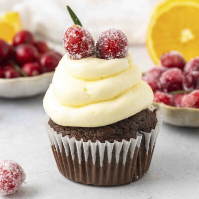 Cupcake topped with candied cranberries.