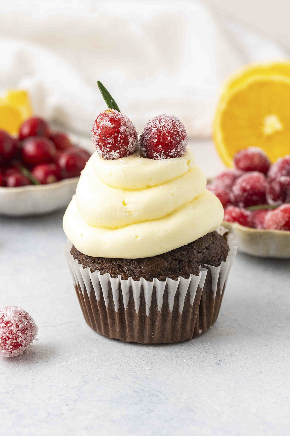 Cupcake topped with candied cranberries.