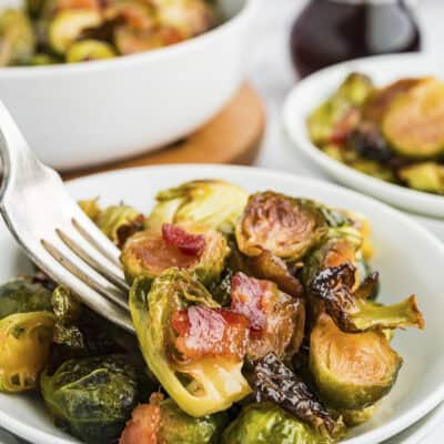 Fork full of Brussel sprouts and bacon.