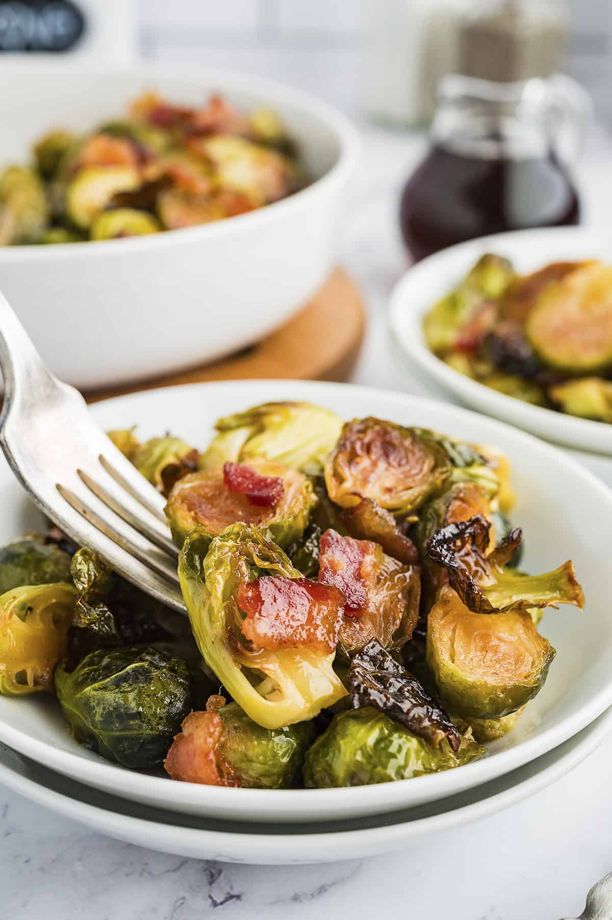 Fork full of Brussel sprouts and bacon.