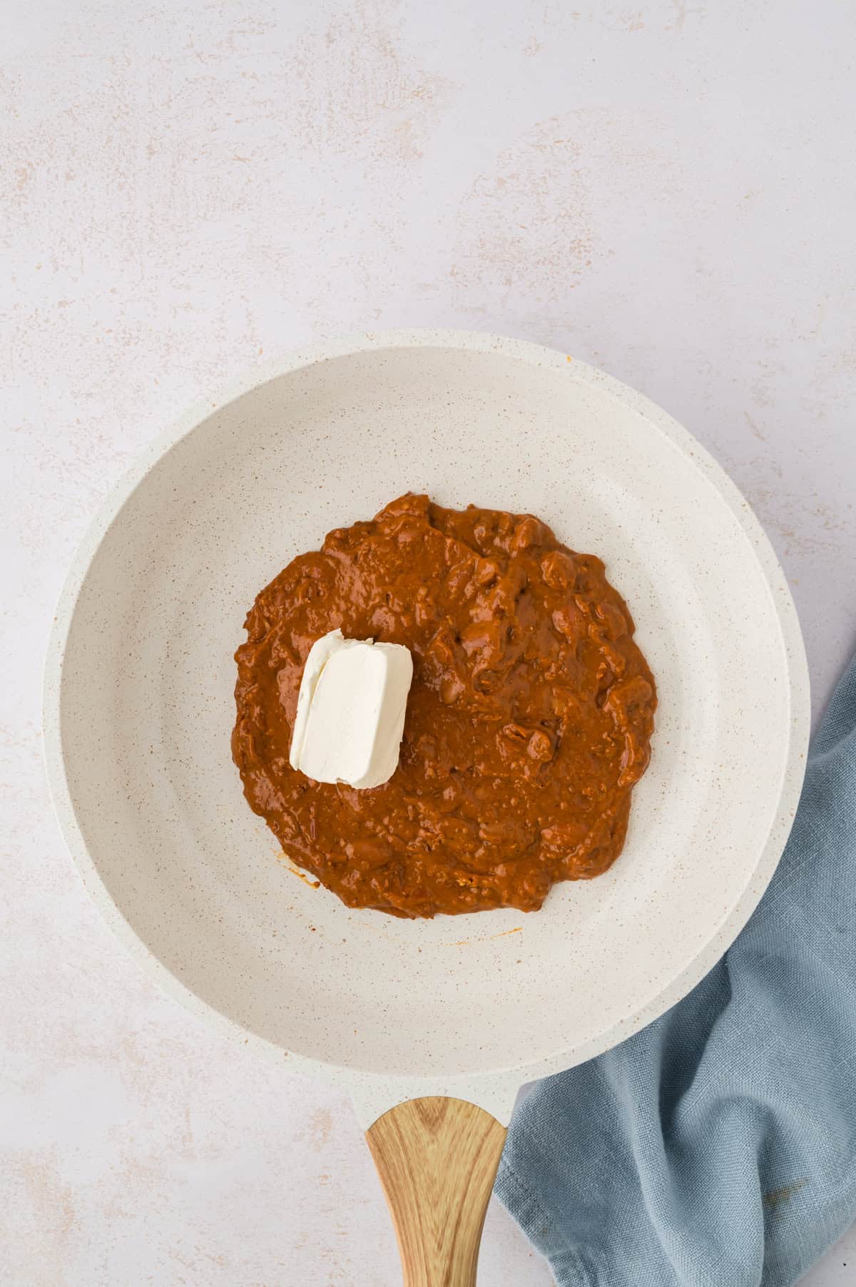 Chili and cream cheese in pot.