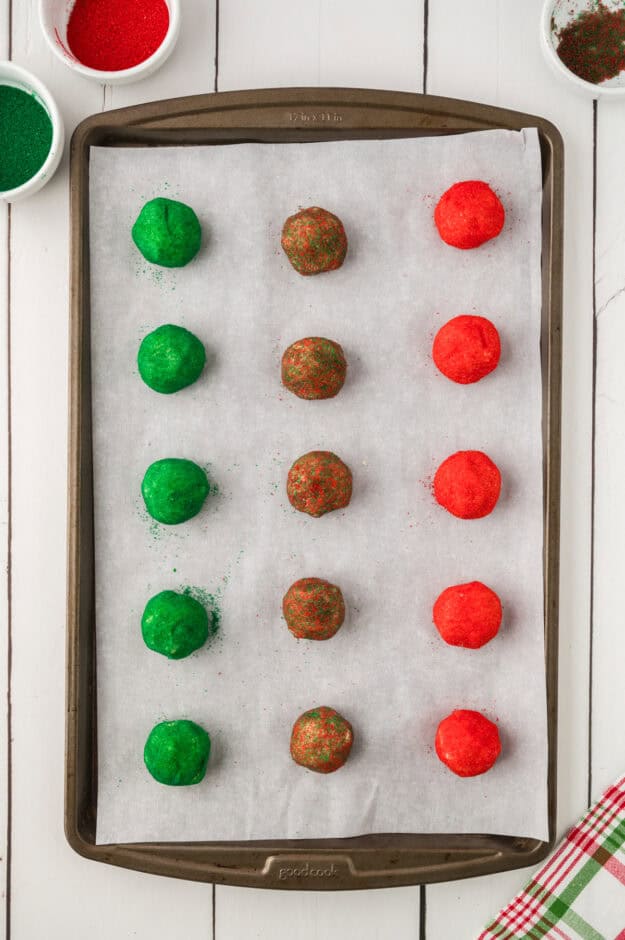 Cookie dough balls on baking sheet.