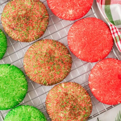 Christmas sugar cookies on cooling rack.