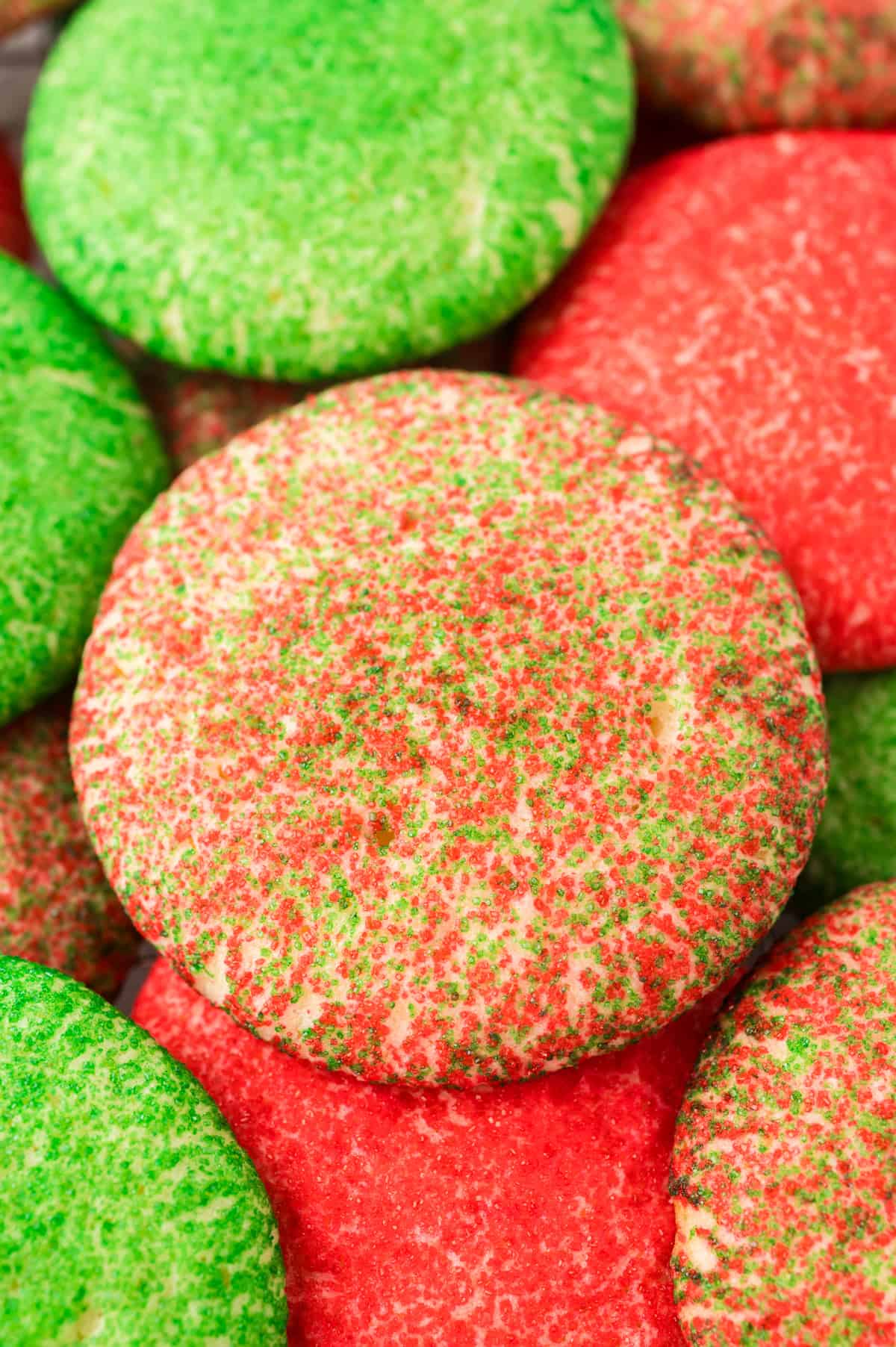 Pile of red and green Christmas sugar cookies.