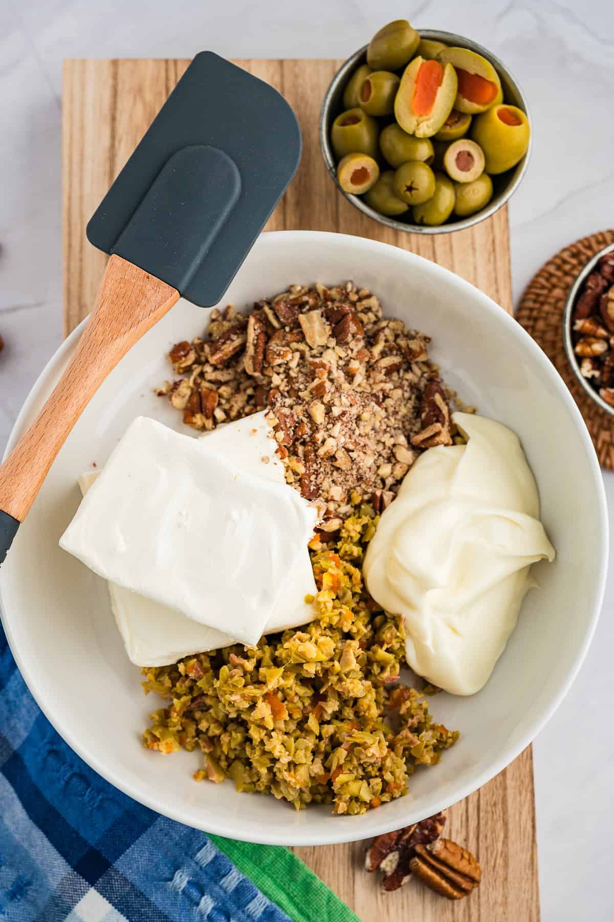 Ingredients for olive spread in mixing bowl.