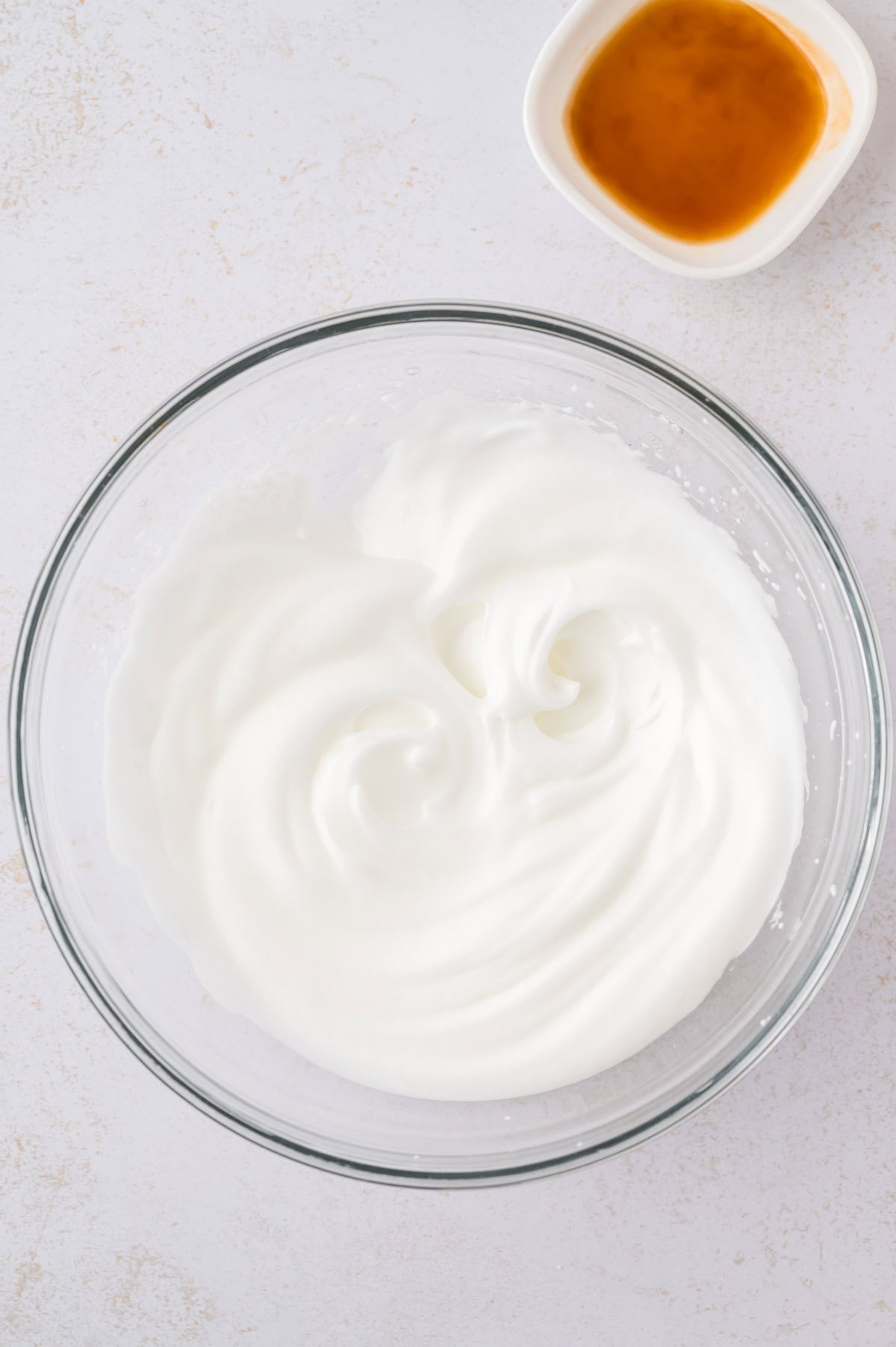 Beaten egg whites in mmixing bowl.