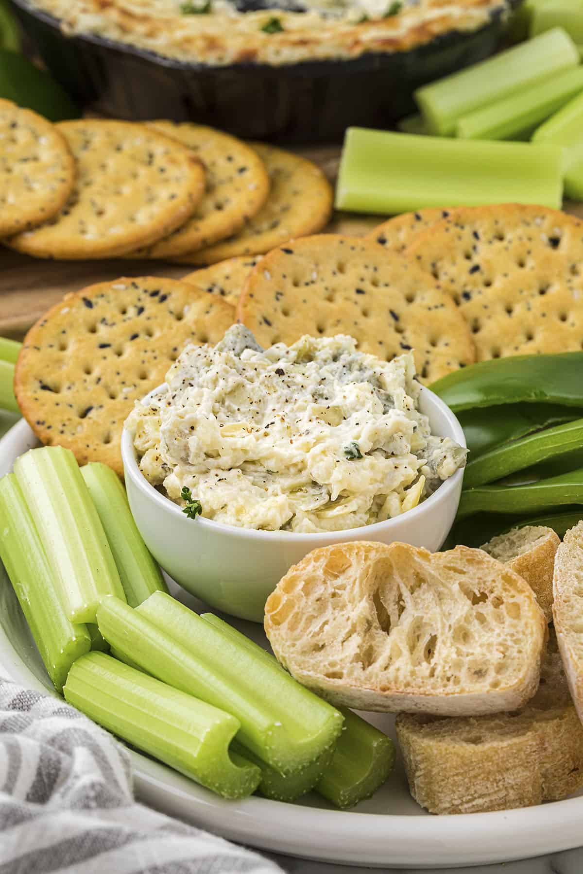 Artichoke jalapeno dip in small bowl.